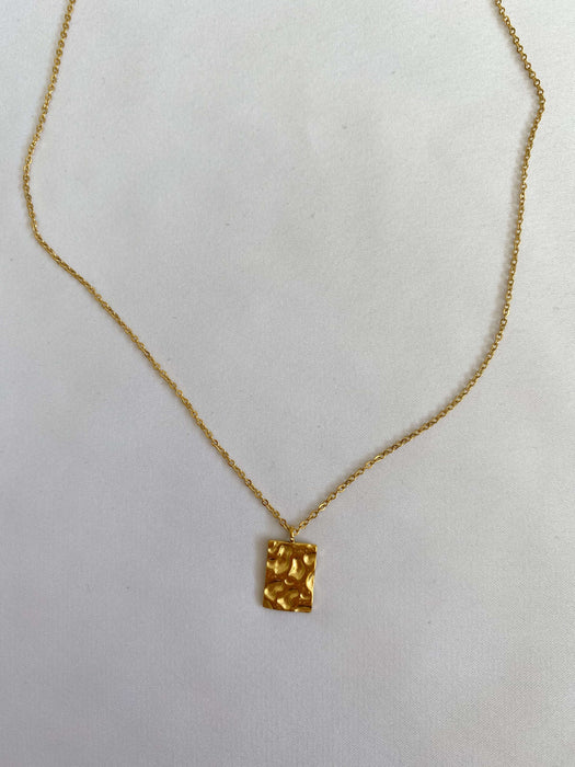 Gold necklace with a amulet
