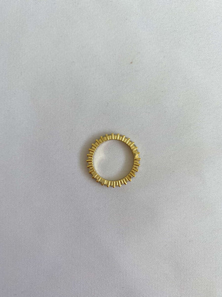 Gold ring with white stones
